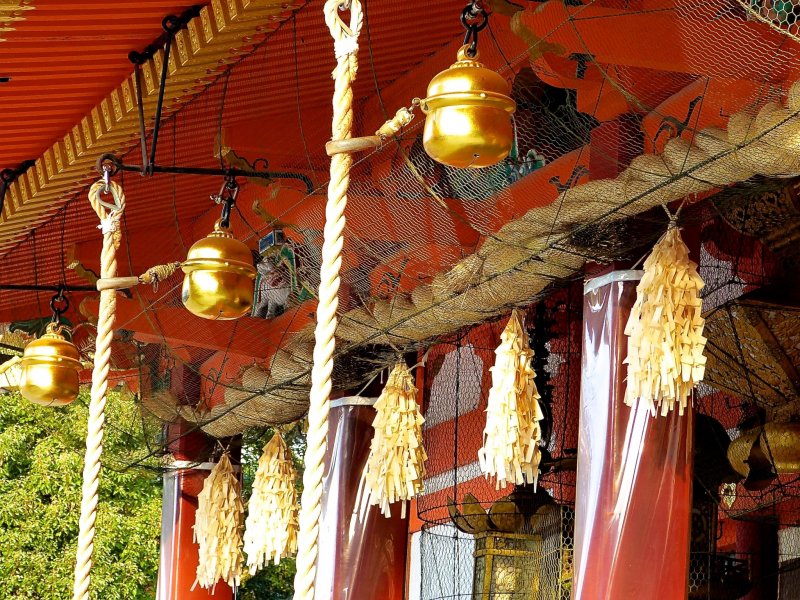 <p>Shining bells under the shrine building</p>