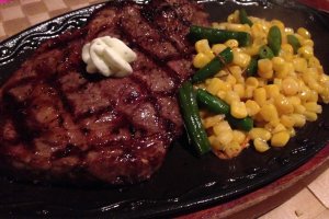 The ribeye steak dinner comes with a sizeable portion of beef and vegetable of the day