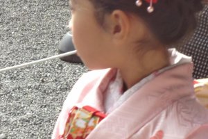 Little girl in pink kimono.