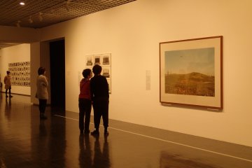<p>Admiring some of the work</p>