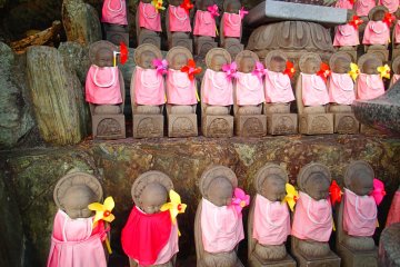 <p>Some of the 70 Jizo Bosatsu figures, in memory of aborted children, located to the left of the Main Hall.</p>