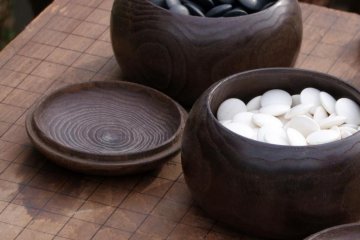 Stones and board for the traditional game of GO