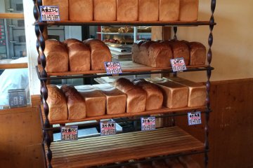 <p>Loaves of fresh bread ready to be bagged up and brought home with you</p>