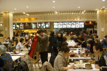 <p>Hawaiian or Korean? Some of the food court stands.</p>