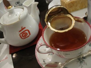 Tea is served in individual teapots for each guest.